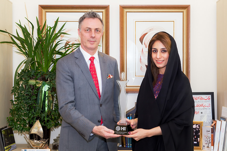 Ameera Abdel Rahim Binkaram with HMH CEO Laurent A. Voivenel